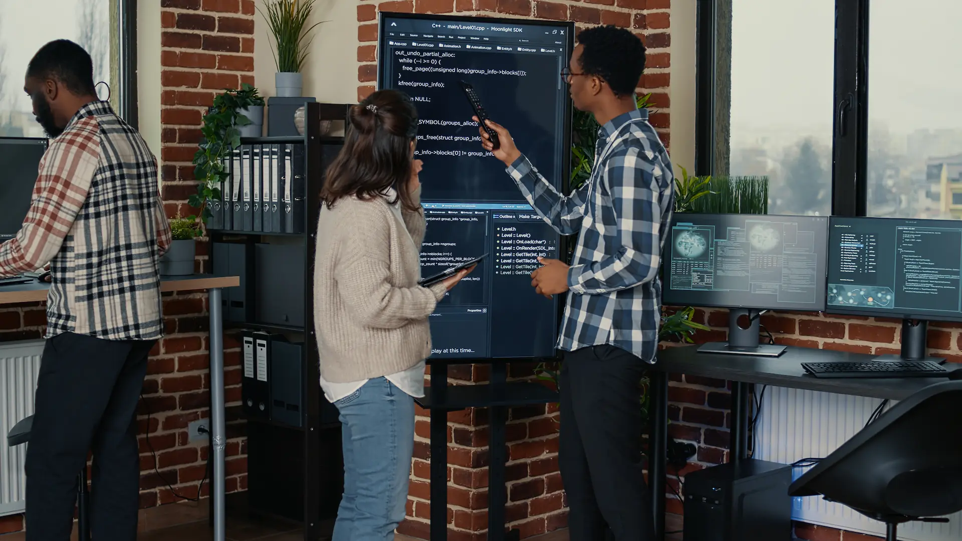 A team database admins analyzing source code wall screen tv comparing errors using digital tablet busy server room two cloud programmers debugging algorithm software innovation office
